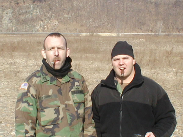 SFC Young and 1SG Williamson of C Troop, 3-6 Cavalry Regiment"Heavy Cav" enjoying an end of FTX smoke at LZ Nightmare, Republic of South Korea, Jan 05.