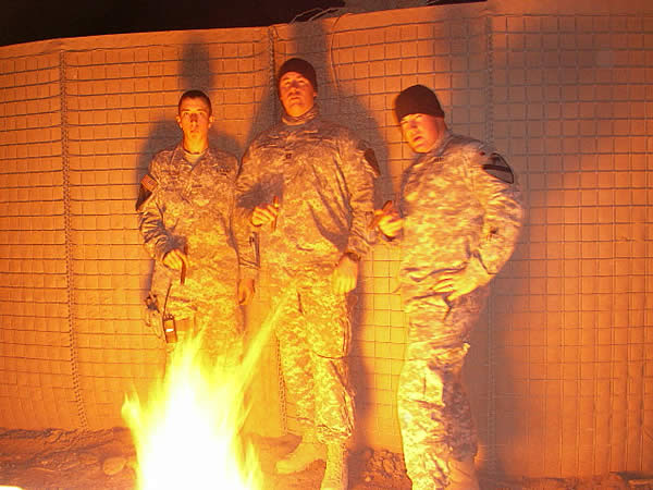 The Officers of E FSC 215 BSB, 1-12 CAV Easy 2LT Glenz, CPT Babington, and 1LT Jennings enjoy some CAO&rsquo;s in Baqubah, Iraq.