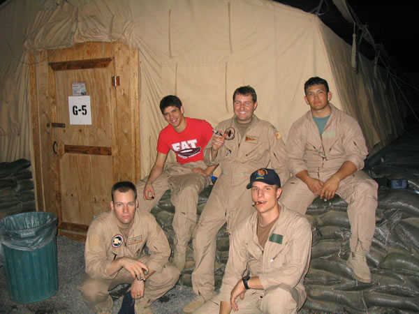 Members of Naval Security Group Activity Bahrain (NSGA Bahrain)  enjoy a post-flight smoke after completing a 10-hour mission while on deployment to Joint Task Force Horn Of Africa (JTF HOA) Djibouti in support of the Global War On Terrorism (GWOT).