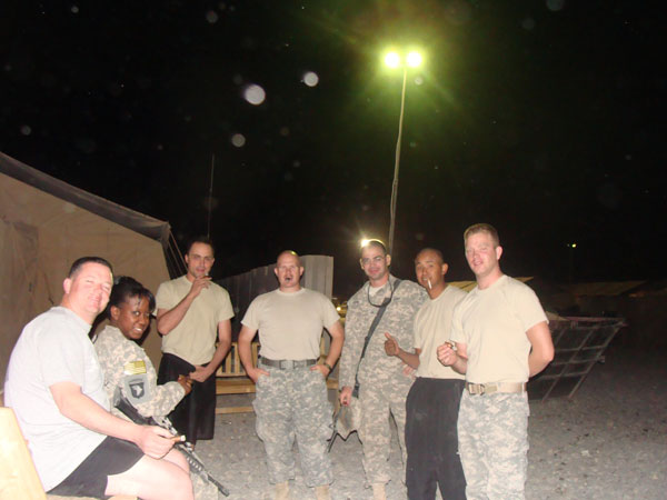 Soldiers enjoy their "cigar night" in Iraq, which is more of an opportunity to bond and decompress as it is to share tastes in fine cigars.