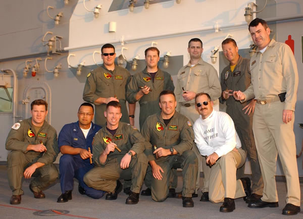 US Navy Officers deployed onboard USS BOXER in the South China Sea.Kneeling in front are LT Topping, LT Cho, LT Neill, LCDR Kennedy, LT Hodskins. Standing in back LT Stephens, LT Blake, CDR Huffaker, CDR Shaub, LCDR Blake.