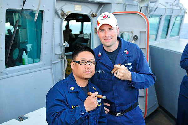 Brandon Cummings and his chief taking a break from a long day on USS BARRY DDG-52, while deployed to the Mediterranean Sea. "Enjoying cigars purchased from C.I. Thanks!"