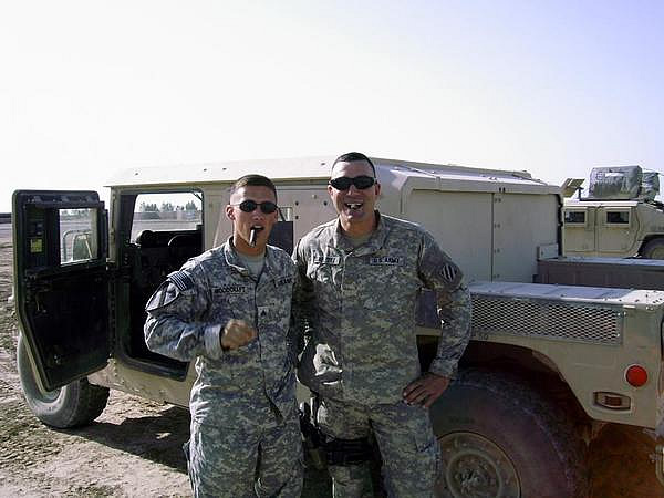 SGT Ryan Woodcraft and MAJ James Carlisle enjoying a cigar at FOB Hammer.