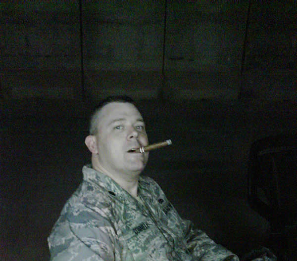 Lt Col Mark Connell enjoying a good cigar in the Baghdad, Iraq after ahard day working at MNSTC-I as a Security Assistance Officer.