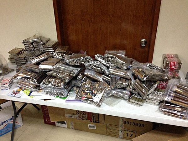 "I returned back from leave to find a ridiculous amount of cigars...just in time for Christmas and the New Year.  We received over 100lbs of smokes...awesome.  My 1st sergeant has been very busy sharing the love across the squadron.  I've attached a couple of pictures of what arrived and a group of us enjoying a smoke after our Christmas meal.  Thanks again for thinking of us!"  - CASEY R. CRABILL, Maj, USAF