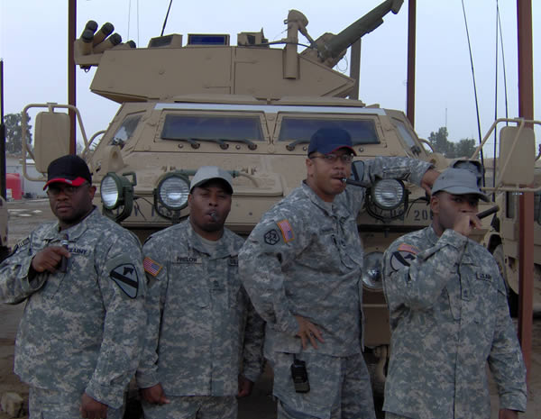 Men of the 15TH SUS BDE 1CD in Taji, Iraq enjoying their &lsquo;Smoke Night Out&rsquo;. From left to right: SSG Cowan, SFC Prelow, SFC Cunningham and SFC Smith.