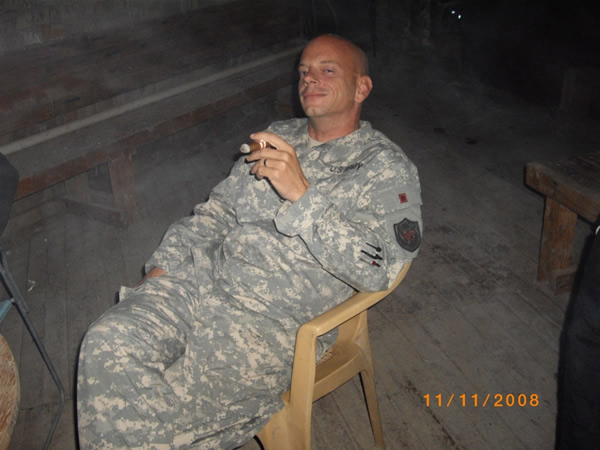 SSG Liberum smoking at the Mudhouse in Iraq