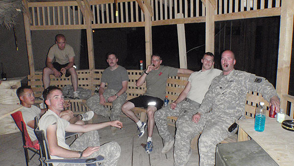 Members of the the C Co 1/189th GSAB MEDEVAC unit currently in Iraq enjoying a few cigars on the evening of 9/11/2011.