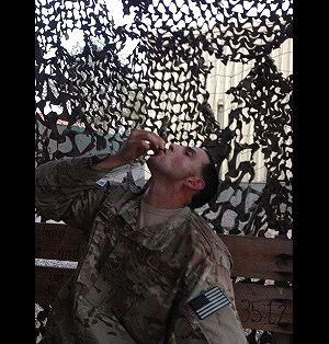 TSgt Mahaffey having a long ash contest in East Africa smoking a Gurkha Status Maduro Torpedo. "I will always buy my cigars from you especially the Gurkha."