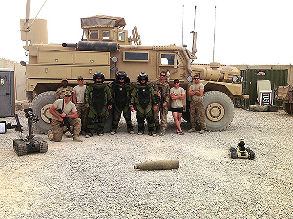 SPC Paul Mummey and other members of the 704th Explosive Ordnance Disposal Company out of Fort Hood, Texas, currently operating in Afghanistan.  "The other members of the company and I typically enjoy our evenings after a long day around the fire pit sharing stories and enjoying a good cigar. That is about the biggest morale boost that we can accomplish in our present location."