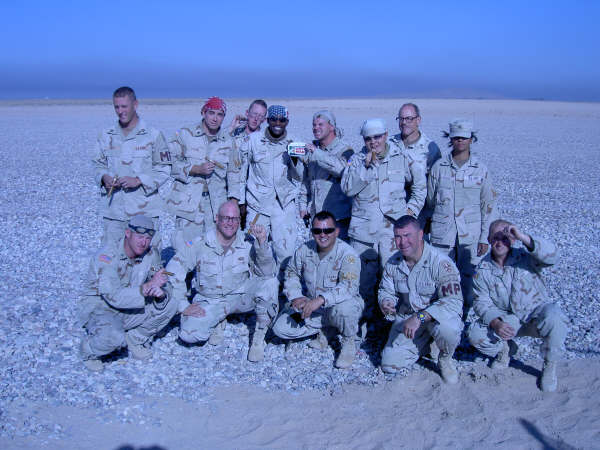 This is 1st Squad, 1st Platoon, 810th MP CO (cs). This was our last mission in Iraq. We had to celebrate, so we got us some cigars and went out with a bang.