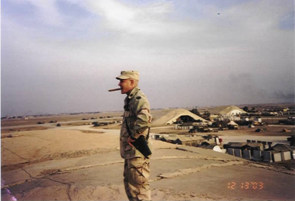 CW2 Jamie Kavanagh smoking a Romeo y Julieta Gran Reserva (Cuban) the day Saddam was captured. Balad, Iraq.
