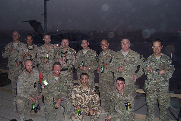 "Every evening when the sun goes down in Afghanistan: we get together to trade and smoke cigars, and drink "non alcoholic" beer."