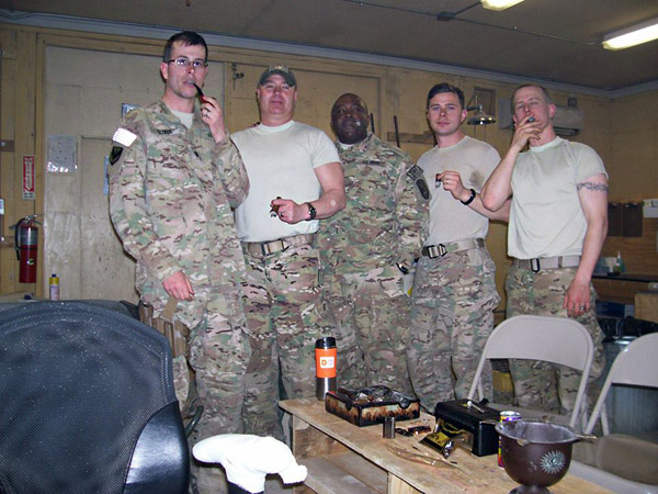 Members of the 909th Postal Company in Afghanistan. SGT Ryan Pierce, Army Reservist from Albany, Oregon on far right. "Thank you for the cigars. We very much appreciated them!"