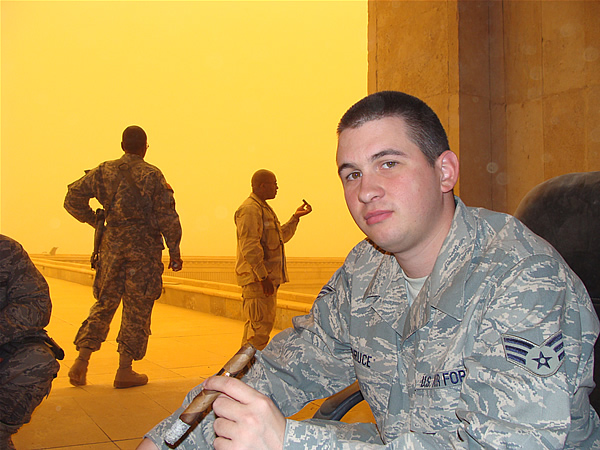 SrA Steven Bruce enjoys a nice cigar while stationed in Iraq.