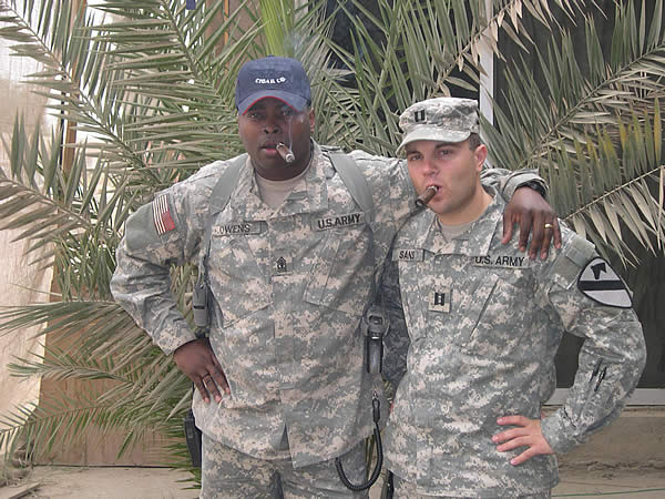 Members of the &lsquo;OUTLAW SMOKE CLUB&rsquo; 1SG Owens and CPT Sans (company XO) of F FSC, 1-8 CAV enjoy a couple of Onyx Reserves at FOB Rustimyah, Iraq.