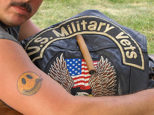 A member of the US Military Vets M/C shows off his new tatoo