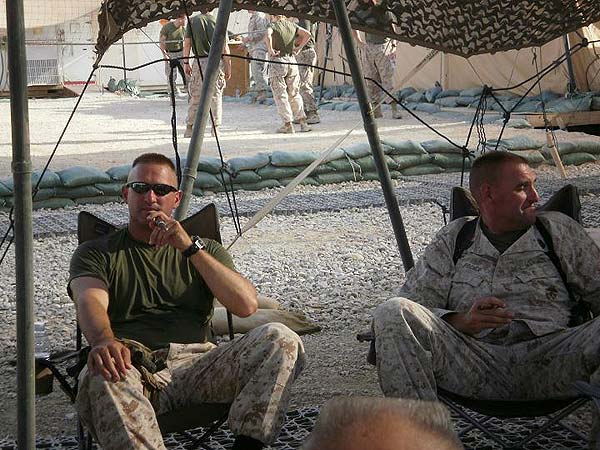 Gunny Granger and Master Sergeant Fischer engaged in intelligent conversation over a fine cigar!