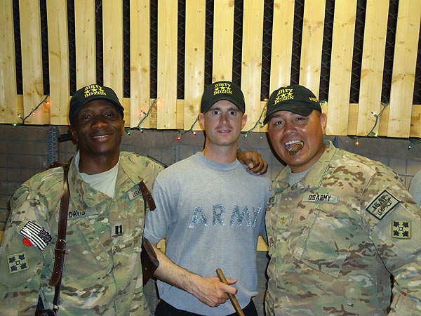 "The Dirty Dozen Cigar Club celebrates another &rsquo;Juma&rsquo; in Afghanistan with some cigars from CI." CPT Davis, CPT Holloway and MAJ Keahtigh smoke it up in the ARV with some tasty smokes from CI.