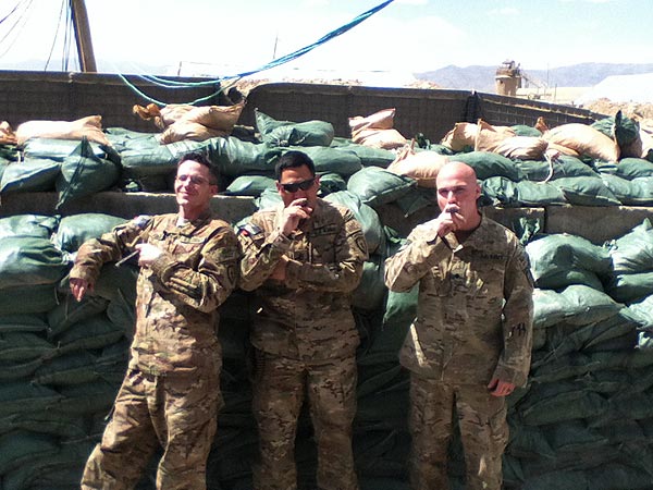 HHC, 725th BSB (A) Soldiers enjoying a cigar after a hard days work in Afghanistan.