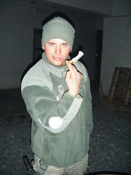 SSgt Jordan Scheller in Afghanistan smoking a Perdomo Lot 23. "Thank you for your support of the troops and for the great service you provide us."