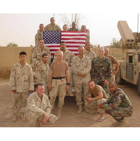 Second Lieutenant John Bardunias (the one standing in dark camo)and the 144 ADA (Aircraft Defense Artillery) Delta Battery.
