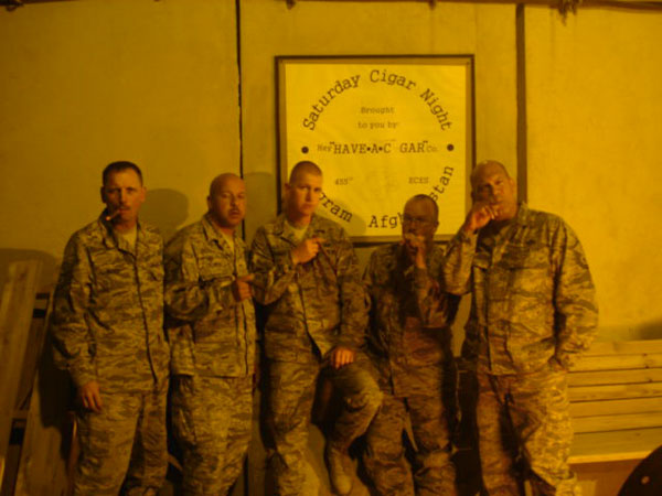 TSgt. Kevin Maier and a few buddies smoking Victor Sinclair, Afghanistan, the night before heading out to a forward operating base.