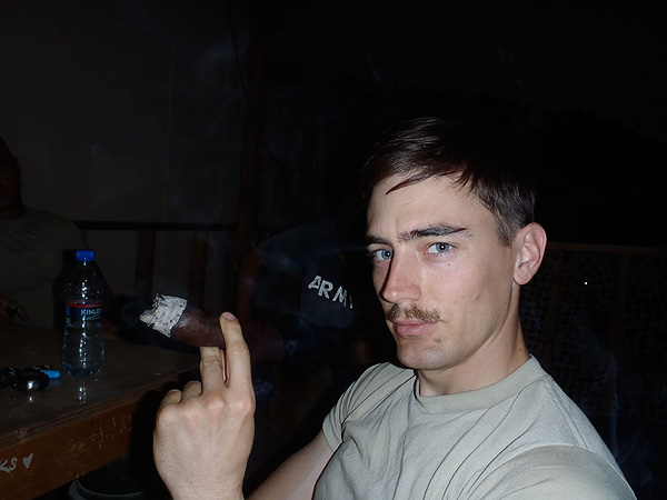 SSG Aaron Merritt of the 744th Explosive Ordnance Disposal Company in Afghanistan enjoying a Drew Estate Egg during his downtime.