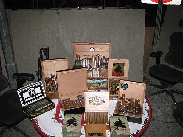 The USFOR-A / NKC 1165th Military Police, stationed in Afghanistan. "Here are some pictures of my fellow Soldiers, friends, and myself enjoying the wonderful cigars that you sell."