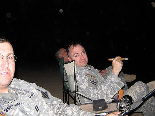 The "Scorpion Cigar and Fishing Club" in Baghdad Iraq. Captain Gary Whittacre (fishing) and LTC Kent Wiley smoking a Stradivarius Cigar. What a way to end a long day in Iraq.