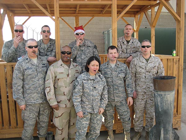 Members of CDDOC in Kuwait enjoying a cigar on Christmas Day!
