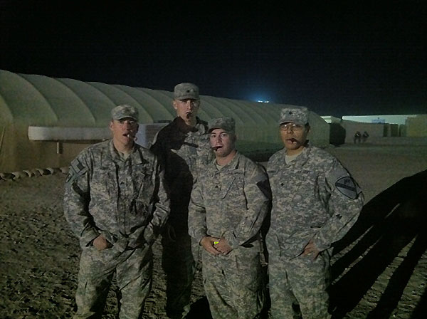From left to right; SGT Hayes, SPC Rhoades, SGT Woznack, and SPC Granillo. Christmas Eve/ End of operations in Iraq celebratory cigars. Taken in Kuwait.