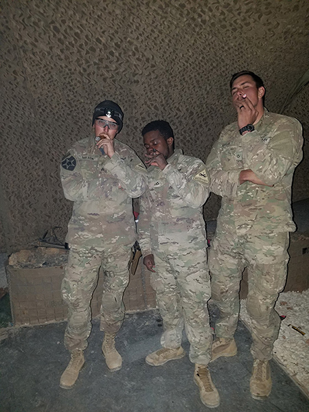 Members of Bandit Troop enjoying some cigars.