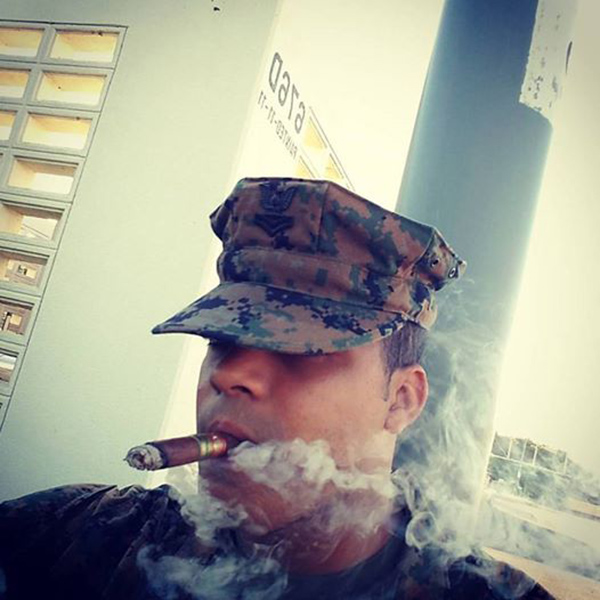 PO2 Dixon enjoying a cigar.