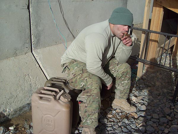 Sgt. David Rosado smoking a Cohiba in Afghanistan