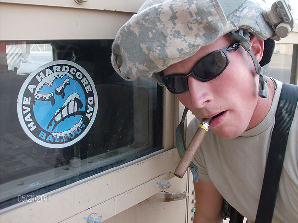 Mechanic CPL Wills with the 310th Expeditionary Sustainment Command in Iraq about to enjoy a Choiba cigar.