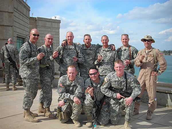 Bill&rsquo;s Smoker Club meets daily at Al Faw Palace, Camp Victory, Baghdad, Iraq. Front Row kneeling from L to R: 1LT Matthew Etheridge, SPC Trevor Cook, SPC Grafton Ashmore. Back standing from L to R: COL David Mullins, SSG Jimmie Rawl,LTC Steve Howard, Bill Hargesheimer, LTC Marc Breslow, COL Phil Stemple, Lt Col Rob McCrady.