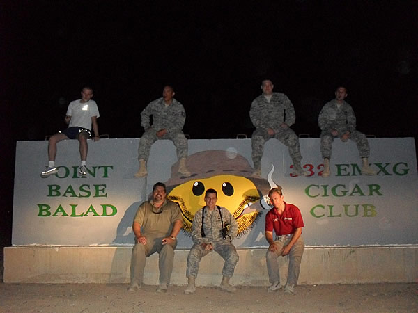 SrA Lemay, TSgt Ramirez, SrA Robinson, SSgt Layton, Mr. Kembro, Lt Col Morrealle, Mr. Mader  all enjoying cigars on our newly painted T-wall in Balad.   SrA Snyder and SrA Robinson painted these T-Wall in about 9 hours.