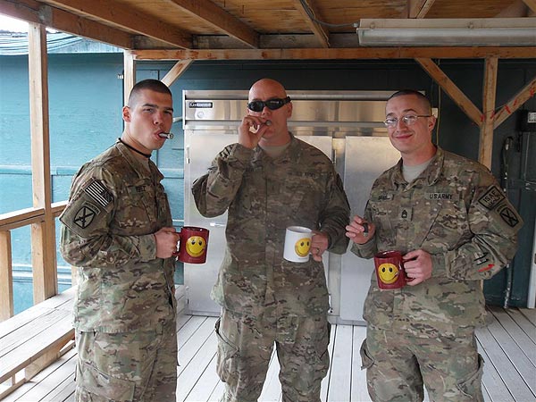 Dear CI,These pictures were taken on 30 JAN 2011 (my birthday) at an airfield in Afghanistan. We wanted to give a shout out to Cigars International by posing with your mugs to thank you for your support of the Troops as well as your quick and efficient ordering and delivery.Thanks again!v/r,-Sergeant First Class Rodney K. AdamsUnited States Army10th Mountain Division