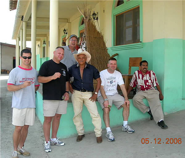 The US Army band of brothers from Soto Cano Air Base in Honduras celebrated the end of their 12 - 24 month tours of duty by touring the PUROS INDIOS cigar factory in Danli, Honduras in May 2006. From left, CPT Crispin Burke, Chaplain CPT Kevin Compston, CPT "Old man" Gene Speer, the friendly gate guard, CPT Blake Lane, and a Puros Indios Staff member.  They are enjoying a NATIONAL cigar from the factory which also produces the Cienfuego line of fine cigars.