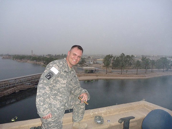 CPT Craig Durante enjoying the smell of victory (Ghurka Beauty) on the roof of the enemy commander&rsquo;s palace in the evening (Iraq).