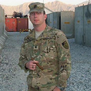 IS1 Justin Tomlinson enjoying a cigar while stationed in Afghanistan. "One of the few back-home remedies that keep smiles on our faces here. Thanks CI."