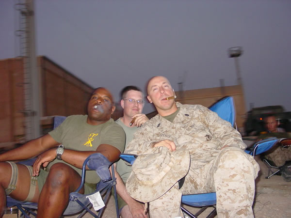 Left to Right:  LTJG Simpkins, LTJG Cooper, Chief Spence, LT Clark of Forward Resuscitative Surgery System 2 / Shock Trauma Platoon 4 (FRSS2/STP4) enjoying the forbidden pleasures of  their Habana Romeo Y Julieta #1&rsquo;s. Al Anbar Province, Iraq, September 2004.