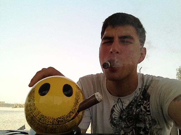 SGT Haasenritter and a new smoke buddy out in the Middle East. "Look at that dashing duo. O_o..l."