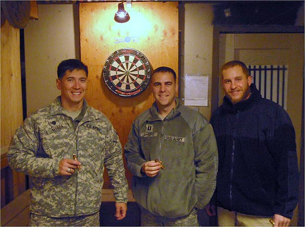 "The attached photos are from an airfield in Afghanistan. Our cigar club &rsquo;meets&rsquo; every Saturday night on the rooftop of our building for smokes and watching the fighter jets streak down the flight line and off into the night&rsquo;s sky. ...We have a little more than a month left and the cigar club has been one liberty that has helped the time move right along!"-Daniel Geisler