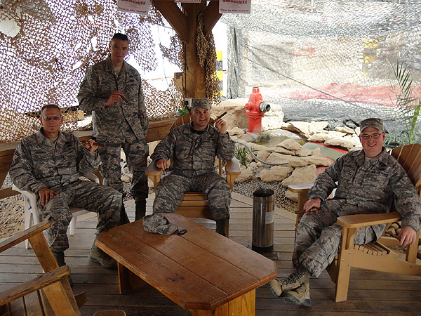 L-R: John , John, Tim and Robert. Members of the 386 ECES in Kuwait chilling out at the fire station oasis smoking Romeo y Julietas and Blue Labels.