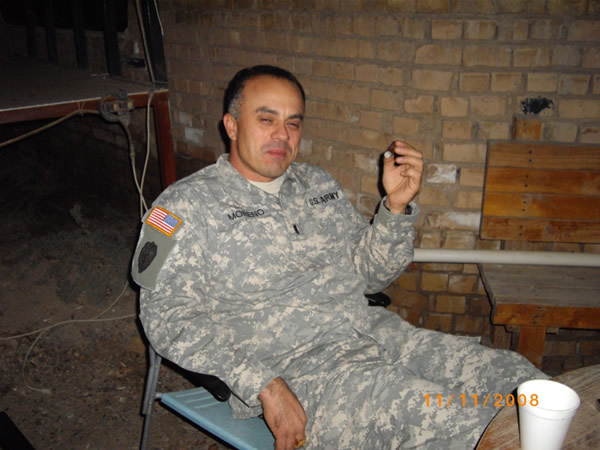 CW3 Moreno enjoying a good cigar at the Mudhouse.