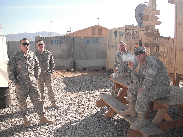 SGT Zic, SFC Scopazzo, 1LT Wilson and CPT Rossol enjoy a daily smoke in Afghanistan.