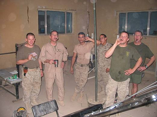 Captain Jonathan Bonar, CWO3 Duncan,  Jaguar (interpreter), Sgt Dominguez, LCpl Levi, Maj Czyia enjoying cigars outside of Baghdad.
