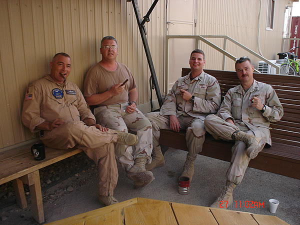 CW4 Di Pasquale, SFC Lods, SSG Desmet and SSG Dion take a cigar break during OIF 05-07. Co D 3/126th AVN Bn,  Aviation Task Force, UAAF, Kuwait.